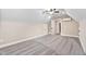 Bright bedroom boasts neutral paint, plush carpet, and a ceiling fan at 293 Carolina Oaks Ave, Smithfield, NC 27577