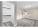 Bright bedroom boasts neutral paint, plush carpet, and a walk-in closet at 293 Carolina Oaks Ave, Smithfield, NC 27577