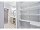 Hallway with shelves leading to bathroom with sink at 293 Carolina Oaks Ave, Smithfield, NC 27577