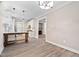 Open-concept living area adjoining a modern kitchen and a cozy fireplace area at 293 Carolina Oaks Ave, Smithfield, NC 27577