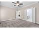 Spacious main bedroom with neutral carpet, and connecting doors to a bathroom and another room at 293 Carolina Oaks Ave, Smithfield, NC 27577
