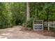 Entrance to Forest Oaks Community Park and Natural Area with informational signage and gravel path at 293 Carolina Oaks Ave, Smithfield, NC 27577