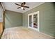 Outdoor screened in porch with wood flooring at 293 Carolina Oaks Ave, Smithfield, NC 27577