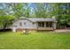A spacious backyard with a screened in porch and room for outdoor entertaining at 3007 Appling Way, Durham, NC 27703