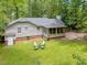 Charming backyard featuring a screened porch and an outdoor seating area at 3007 Appling Way, Durham, NC 27703