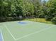 Outdoor basketball court, perfect for sports and recreation, framed by green surroundings at 3007 Appling Way, Durham, NC 27703