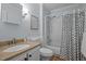 Bathroom features a tub and shower combo, modern vanity, and neutral tiling for a clean and functional space at 3007 Appling Way, Durham, NC 27703