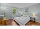 Bedroom features a large window, hardwood floors, and neutral paint at 3007 Appling Way, Durham, NC 27703