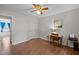 Bedroom featuring hardwood floors, desk, ceiling fan and closet for a functional space at 3007 Appling Way, Durham, NC 27703