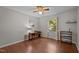 Bedroom featuring hardwood floors, desk, ceiling fan and window overlooking green lawn for a perfect home office at 3007 Appling Way, Durham, NC 27703