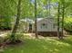 Charming single-Gathering home with green shutters surrounded by mature trees and landscaping at 3007 Appling Way, Durham, NC 27703