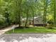 Charming single-Gathering home with green shutters surrounded by mature trees and landscaping at 3007 Appling Way, Durham, NC 27703