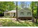 Charming single-Gathering home with green shutters surrounded by mature trees and landscaping at 3007 Appling Way, Durham, NC 27703