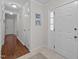 Inviting entryway with white interior door, tile flooring, and hallway leading to living spaces at 3007 Appling Way, Durham, NC 27703