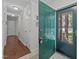 Inviting entryway with green front door, tile flooring, and hallway leading to living spaces at 3007 Appling Way, Durham, NC 27703