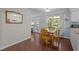Eat-in kitchen with stainless appliances, breakfast nook, and hardwood floors at 3007 Appling Way, Durham, NC 27703