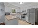 Kitchen features stainless steel appliances, white cabinets, and plenty of counter space at 3007 Appling Way, Durham, NC 27703