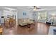 Open-concept living room flows into dining area; lots of natural light, hardwood floors at 3007 Appling Way, Durham, NC 27703