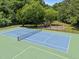 Aerial of the tennis court and playground. Features recreation for residents at 3007 Appling Way, Durham, NC 27703
