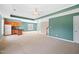 Large basement featuring carpeted floors, a kitchenette, neutral paint, stairs, and large open space at 306 Neuse Ridge Dr, Clayton, NC 27527