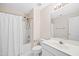 Bathroom featuring white tile flooring, white vanity, and shower with a white shower curtain at 306 Neuse Ridge Dr, Clayton, NC 27527