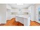 Well-appointed kitchen with white cabinets, granite counters, and stainless steel appliances at 306 Neuse Ridge Dr, Clayton, NC 27527