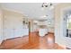Spacious eat-in kitchen with white cabinetry, center island, and hardwood floors at 306 Neuse Ridge Dr, Clayton, NC 27527