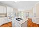 Bright kitchen island with granite countertops and modern cooktop, perfect for entertaining at 306 Neuse Ridge Dr, Clayton, NC 27527