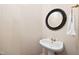 Charming powder room features stylish mirror and pedestal sink at 306 Neuse Ridge Dr, Clayton, NC 27527