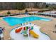 Community splashpad area featuring colorful slides and water features for Gathering fun at 306 Neuse Ridge Dr, Clayton, NC 27527