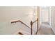 Staircase with carpeted steps and wood railing at 306 Neuse Ridge Dr, Clayton, NC 27527