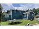 Spacious backyard featuring lush green grass, trampoline, basketball court, and a well-maintained exterior at 3129 Skycrest Dr, Raleigh, NC 27604