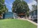 Backyard features include a lush lawn, storage building, gazebo, and flower boxes at 3129 Skycrest Dr, Raleigh, NC 27604