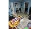 Bedroom with a black and white checkered tile, walk-in closet, chair and blankets at 3129 Skycrest Dr, Raleigh, NC 27604