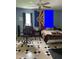 Bedroom with decorative flags on the wall, checkered floors, and large office chair at 3129 Skycrest Dr, Raleigh, NC 27604
