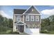 Charming two-story home with stone accents, gray siding, white trim and a two car garage at 317 Calvander Ln, Apex, NC 27539