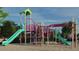 Colorful community playground with slides, climbing structures, and ample space for children to play at 317 Calvander Ln, Apex, NC 27539