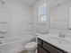 Clean bathroom with a tub-shower combo, vanity with a sink, and bright natural light at 319 Great Northern Station Sta, Apex, NC 27502