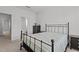 Bedroom with a bathroom ensuite, featuring a dark metal bed frame at 319 Great Northern Station Sta, Apex, NC 27502