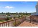 Large wooden deck overlooking a parking lot and commercial buildings at 319 Great Northern Station Sta, Apex, NC 27502