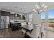Open kitchen and dining area features stainless steel appliances and patio access at 319 Great Northern Station Sta, Apex, NC 27502