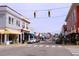 Historic downtown street with local shops and pedestrian crosswalk at 319 Great Northern Station Sta, Apex, NC 27502