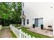 Back of home with mature landscaping, manicured yard, and concrete patio with a grill at 320 Gilman Ln # 106, Raleigh, NC 27610