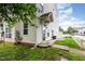 Back of home with well manicured yard, concrete patio, and mature landscaping at 320 Gilman Ln # 106, Raleigh, NC 27610