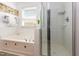 This bright, white tiled bathroom features both a jetted tub and glass enclosed shower at 320 Gilman Ln # 106, Raleigh, NC 27610