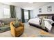 Spacious bedroom featuring large bed, side tables and sitting area with chairs and baby furniture at 320 Gilman Ln # 106, Raleigh, NC 27610