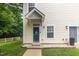Charming two-story home with a welcoming front door and a landscaped yard at 320 Gilman Ln # 106, Raleigh, NC 27610