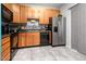 The bright kitchen features stainless steel refrigerator and plentiful cabinet space at 320 Gilman Ln # 106, Raleigh, NC 27610