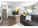 Open-concept living room showcasing a staircase and kitchen at 320 Gilman Ln # 106, Raleigh, NC 27610