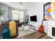 Living room with a sectional sofa, coffee table, and entertainment center with TV at 320 Gilman Ln # 106, Raleigh, NC 27610